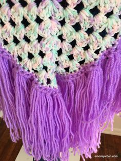 Lovely lavender v-shaped shawl with multi-pastel colored design around the neck and waist. Fringed bottom giving it a chic boho look. Can be worn in multiple ways. Purple Festival Scarves, Purple Bohemian Scarf, One Size, Bohemian Purple Scarf One Size, Purple Bohemian Scarf One Size, One Size Purple Bohemian Scarf, One Size Bohemian Purple Scarf, Purple Crochet Scarf One Size, Purple Crochet Scarves One Size, One Size Purple Crochet Scarf