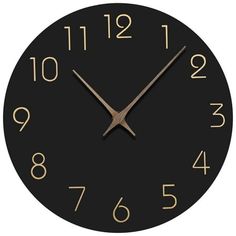 a black clock with gold numbers on it