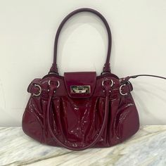 Salvatore Ferragamo Gancini Handbag Marissa Wine Red Brand New, Authentic Ferragamo Handbag, Never Been Used, Tag Is Still Attached, In Excellent Condition! Comes With Original Dust Bag. W Approx. 45 (Maximum) Cm X H Approx. 25 Cm Handle: Approx. 47cm Designer Burgundy Top Handle Shoulder Bag, Designer Burgundy Satchel Bag, Luxury Burgundy Bags With Silver-tone Hardware, Designer Burgundy Shoulder Bag For Shopping, Designer Burgundy Shoulder Bag With Double Handle, Designer Burgundy Satchel With Detachable Handle, Designer Burgundy Satchel With Top Handle, Designer Burgundy Top Handle Satchel, Designer Burgundy Satchel For Evening