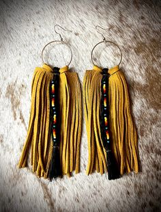 "Genuine golden deerskin fringe, black fish tail braided horsehair, double serape bead pattern, sterling silver hooks, 5\" length, soft, lightweight, durable. Message me if you would like a custom pair with your horses hair!  Cost for custom order with your horses hair add $25.  This includes all other changes of fringe, length, beads and colors. Please note, custom orders will take longer due to shipping, receiving, and customizing. Thank you!" Horse Hair Earrings, Southwestern Fringe Dangle Earrings, Southwestern Tassel Earrings For Festivals, Southwestern Fringe Earrings For Festivals, Southwestern Brown Fringe Jewelry, Southwestern Tassel Earrings, Traditional Fringe Earrings, Adjustable Brown Earrings With Beaded Fringe, Adjustable Handwoven Dangle Tassel Earrings