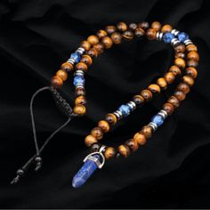 1. Enhance Your Style With This Exquisite Brown Tigers Eye Beaded Necklace Featuring An Adjustable Design For A Perfect Fit. 2. The Necklace Is Adorned With A Stunning Lapis Lazuli Point Pendant, Adding A Touch Of Elegance And Sophistication To Any Outfit. 3. Crafted With Attention To Detail, The Combination Of The Rich Brown Tigers Eye Beads And The Deep Blue Lapis Lazuli Creates A Harmonious And Eye-Catching Contrast. 4. Whether You're Attending A Special Occasion Or Simply Want To Elevate You Brown Beaded Necklaces With Stones, Adjustable Brown Beaded Necklaces With Stones, Adjustable Brown Beaded Necklace With Stones, Brown Spiritual Beaded Necklaces With Stones, Spiritual Brown Beaded Necklaces With Stones, Spiritual Brown Beaded Necklace With Stones, Celestial Blue, Brown Tiger Eye, Lapis Pendant