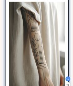 a woman's arm with tattoos on it and an image of a plant in the background