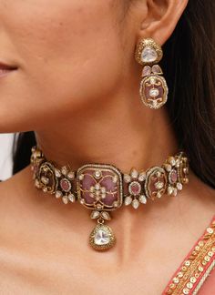 Pretty fine Victorian Kundan choker with pink/Red colored stones and Kundan and Zirconia Necklace with matching earrings The Necklace has adjustable Dori.  The Earrings Have Pushbacks  Highest quality and craftsmanship. Arrives in a box Please let me know if you have any questions Customized orders takes 3 to 4 weeks, depending on piece requirements.  The Ombre Designs Jewelry pieces can be customized in accordance with your requirement.  Please Email or Whats app on : +91 8448833193 / sonalikamehra@theombredesigns.com Pink Choker Necklace Indian, Heavy Choker Bridal Necklace For Reception, Bollywood Style Choker For Reception Hand Set, Heavy Bridal Choker Necklace For Reception, Heavy Bridal Choker For Reception, Pink Temple Jewelry Necklace For Ceremonial Occasions, Traditional Choker Jewelry For Receptions, Traditional Choker Jewelry For Reception, Pink Temple Jewelry For Ceremonial Occasions