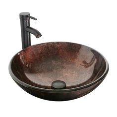 an oval glass sink with a black faucet