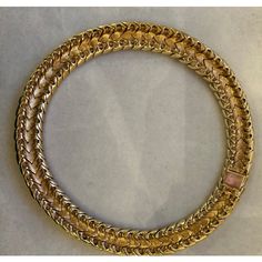 This is part of Chairish’s Costume Jewelry assortment.  A magnificent and weighty gold-tone and white enameled Ciner choker/collar, ca. late 1950s/early 1960s.  This choker belonged to a notable costume jewelry industry professional, who worked for Trifari.  Ciner jewelry was founded in New York City in 1892 as a fine jeweler and this family-owned operation is still in business today!  Since 1931, the company has produced fine costume jewelry. Luxury Gold Evening Choker, Luxury Gold Choker For Evening, Vintage Gold Round Choker, Luxury Gold Choker With 17 Jewels, Gold Choker With 17 Jewels, Gold Round Costume Jewelry Choker, Gold Costume Jewelry Choker, Ciner Jewelry, Chanel Flower