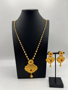 Elevate your traditional attire with our exquisite Gold Plated Ball Chain Rani Haar Set. This stunning piece is a perfect blend of elegance and sophistication, designed to make you shine at any special occasion. Care Instructions  To maintain its shine and quality, avoid direct contact with water, perfumes, and other chemicals. Store in a dry place. Gold Temple Jewelry Chain Necklace For Wedding, Traditional Gold Plated Chain Necklace For Festive Occasions, Festive 22k Gold Jewelry Sets For Puja, 22k Gold Jewelry Sets For Puja And Festive Occasions, Bollywood Style Gold-plated Temple Necklace With Latkans, Yellow Gold Jewelry Sets For Puja And Festivals, 22k Gold Jewelry Set With Latkans For Festivals, Gold Plated Kundan Necklace For Diwali, Yellow Gold Plated Kundan Necklace For Diwali