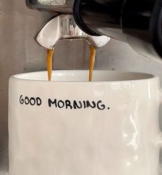 coffee being poured into a mug with the words'good morning'written on it