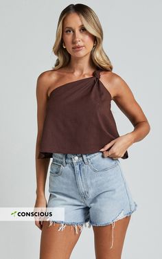 Get ready to make a statement with our Analia Top in Chocolate! This one shoulder knot detail top is the perfect addition to your casual wardrobe. Made from soft and comfortable rayon, this fashion-forward piece will turn heads wherever you go. Whether you're dressing it up for a night out or keeping it casual with jeans, the Analia Top is sure to elevate any outfit. Embrace your individuality and show off your unique style with this empowering and inclusive fashion top. Don't miss out on this m Shoulder Knots, Inclusive Fashion, Fashion Top, One Shoulder Tops, Casual Wardrobe, Casual Style, Unique Style, Fashion Forward, Night Out