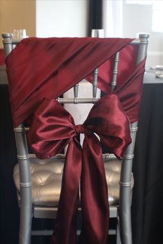 a chair with a red bow tied to it