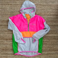 New Without Tags - Such A Chic Fun And Bright Camping Layer! Women’s Xl Men’s Large Product Details Highly Packable And Weather-Resistant, The Teca Half-Zip Windbreaker Is Made From Panels Of Repurposed Polyester Taffeta, And Features An Interior Chest Pocket That Doubles As A Storage Pouch. The Teca’s Dwr-Finished Fabric And Packable Design Make It Great For Hiking, Camping, And Throwing In Your Travel Bag As That Ultralight, Just-In-Case Layer. Its Form-Fitting Scuba Hood And Front Zip Help Yo Pink Nylon Hiking Outerwear, Pink Nylon Outerwear For Hiking, Sporty Pink Outerwear For Outdoor, Pink Windbreaker For Outdoor Activities With Pockets, Pink Nylon Windbreaker For Outdoor Activities, Casual Pink Outerwear For Hiking, Pink Hooded Windbreaker For Outdoor Activities, Casual Pink Color Block Windbreaker, Functional Pink Nylon Windbreaker