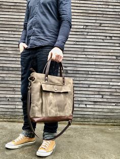 Briefcase made from heavy weight waxed filter twill in the colour ranger tan and oiled leather in the color bordeaux brown, I love the combination of these to materials. I made it big enough for laptop , and all your other necessaties. This bag is lined with a cotton canvas and there is a double inside pocket on one side. There is a large outside pocket where you can store your laptop charger and other stuff and a luggage handle attachment on the back side It closes with a metal zipper and the s Utility Waxed Canvas Bags For Outdoor, Outdoor Utility Bag In Waxed Canvas, Brown Canvas Briefcase For Everyday Use, Functional Canvas Satchel With Waxed Finish, Brown Waxed Canvas Briefcase With Adjustable Strap, Functional Canvas Bag With Waxed Finish, Rugged Canvas Bags With Pockets, Functional Waxed Canvas Briefcase For Everyday, Waxed Coated Canvas Satchel Bag