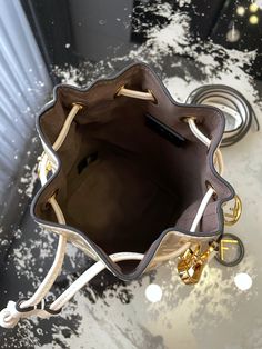 FÉŃĎI mini bucket - featuring  elements! Retro street feeling is full, even if it is small, it will not delay to accommodate travel needs.

Size: 12-10-18 High-end Bucket Bag For Errands, Designer Bucket Bag With Dust Bag For Errands, High-end Everyday Pouch Bucket Bag, Designer Bucket Bag For Travel, Designer Travel Bucket Bag, Travel Shoulder Bag With Branded Hardware, Bucket Shape, Designer Bucket Bag With Branded Hardware, High-end Bucket Bag With Detachable Strap For Travel, High-end Bucket Bag For Travel