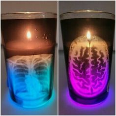 two glasses with different colored liquids in them, one is lit up and the other has a