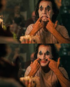 the joker is making his face look like he's getting ready to eat some food