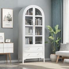 a white bookcase in a living room