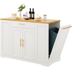 a kitchen island with wine bottles and glasses on it's top, next to an open cabinet