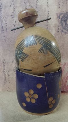 a blue vase with an artistic design on it