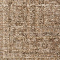 an area rug with brown and beige colors