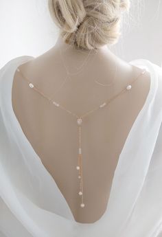 This is an original design by © Isabella Bridal. DETAILS - Freshwater pearl  -Cubic Zirconia teardrop  - Drop length: 6.5 inches. -Primary color: Silver, Rose Gold -The back necklace has a clasp(lobster claw) on each end to attach to the back of a dress. Note: You must attach loops to the dress in order to clip back jewelry. Feel free to contact me with any questions! Custom orders are welcome. All orders will ship within 48 hours, except for weekends ALL ORDERS ARE SHIPPED VIA USPS FIRST CLASS WITH TRACKING. Handmade in the USA. This item is Made-to-Order and therefore is a final sale. Necklace Wedding Dress, Wedding Dress Back, Wedding Dress Backs, Jewelry Rose Gold, Bridal Details, Back Necklace, Y Necklace, Back Drop, Dress Back