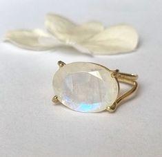 Big solitaire moonstone ring, delicate oval gemstone romantic jewelry for women, available in 14k gold plating, sterling silver, solid 9k yellow gold, or 14k yellow/white/rose gold.  This elegant handmade gold ring is large but highly delicate. It has been carefully crafted from fine gold wires and features an oval faceted moonstone. While the design highlights the stone, making it the ring's centerpiece, the structure accentuates its beauty.  It is available in high-quality 14k gold plating, st Yellow Gold Oval Moonstone Ring For Gift, Yellow Gold Oval Moonstone Ring, Elegant Oval Cabochon Moonstone Ring As Gift, Yellow Gold Oval Moonstone Promise Ring, Elegant Oval Moonstone Ring, Minimalist Oval Moonstone Wedding Ring, Delicate Oval Moonstone Ring, Elegant Oval Cabochon Moonstone Ring For Gift, Delicate Oval Moonstone Ring In 14k Gold