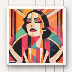 a cross stitch pattern of a woman's face with colorful lines in the background