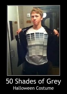 a man holding up a jacket with the words 50 shades of grey on it