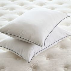 Details Material: Encased in 100% cotton shell; 233-thread count with Visco fiber fill. Design: White corded border on firm pillow and Gray border on soft pillow. Comfort Levels: Firm Pillow: Overstuffed memory foam-like feel. Perfect for sleepers who prefer supportive pillows. Soft Pillow: Support that you can sink into. Perfect for stomach and side sleepers. Hypoallergenic: Fiber fill covered with antimicrobial dust mite-barrier. Hospitality Grade: Featured in Westin Hotels. Variety: Available Firm Pillow, Firm Pillows, Side Sleeper, Soft Pillow, Dust Mites, Soft Pillows, Made In America, King Size, In America