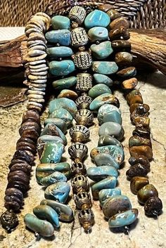 This Beauty Bundle has 2 strands of large green, 1 strand of medium brown, turquoise stones with Antique African Brass with small brown and tan, turquoise disks.  This bundle is perfect for the jewelry crafter, professional and novices alike.  Each 10-inch strand gives you 50 inches of different shapes, sizes and textures to create beautiful jewelry.   The possibilities are limitless, necklaces, bracelets, earrings!  These Beauty Bundles are great gift ideas! Beauty Bundles, African Brass Beads, Vert Turquoise, Beauty Bundle, Turquoise Stones, Brass Accents, Green Turquoise, Medium Brown