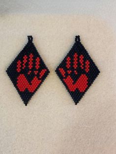 The beaded segment of these earrings is approximately 5cm long and 3.5cm wide.  I will be donating 25% of profit to The Native Women's Association of Canada [https://www.nwac.ca/nwac/] from any sales of MMIWG/MMIWGT2S themed items to honour our stolen sisters, Trans and 2Spirit souls. Red Dress Day honours the spirits of missing and murdered Indigenous women, girls, transgender and 2spirit souls. On May 5, you may have noticed red dresses and ribbons pop up in windows and trees across Canada and other parts of Turtle Island. ITEM DESCRIPTION:  - You will receive one pair of beautiful handcrafted colourful beaded earrings. - These earrings are made using 11/0 glass Miyuki delica beads, traditional Indigenous beading techniques, and nylon thread. - These earrings are perfect for wearing on M Red Dress Earrings, Red Dress Beaded Earrings, Mmiw Beaded Earrings Pattern, Mmiw Red Dress Earrings, Beaded Earrings Native Beadwork, Red Dress Indigenous, Beaded Earrings Native Beadwork Red, Beaded Turtle Earrings, Red Beaded Dress