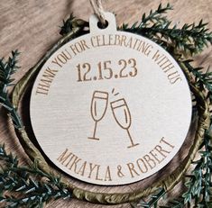 a wooden ornament with two wine glasses on it and the words, thank you for