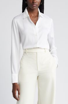 This versatile button-up blouse is irresistibly updated in luxe stretch silk with easy-moving back pleats and a tuckable high/low hem. 27" length (size Medium) Front button closure Spread collar Long sleeves with single-button cuffs Back yoke with box pleat 92% silk, 8% spandex Dry clean or hand wash, line dry Imported Individualist Classic Solid Viscose Blouse, Fitted Versatile Blouse With Button Closure, Versatile Fitted Blouse With Button Closure, Business Casual Silk Blouse With Button Closure, Formal Button-up Viscose Tops, Fitted Button-up Versatile Blouse, Versatile Fitted Button-up Blouse, Fitted Button-up Blouse, Formal Viscose Tops With Button Closure