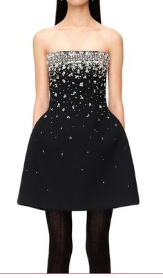 CRYSTAL BEADING STRAPLESS MINI DRESS IN BLACKTurn heads and make a statement in this Crystal Beading Strapless Mini Dress in Black. With its stunning design and attention to detail, this dress is sure to dazzle at any event. The strapless bodice is adorned with light-catching crystal beading, adding a touch of sparkle that will have all eyes on you.This lustrous mini dress features sparkling crystal details up top that steal the spotlight. The black color adds a touch of sophistication, while the mini length adds a flirty and playful element to the dress. Whether you're attending a cocktail party, a night out with friends, or a special date night, this dress is the perfect choice to make a lasting impression.The dress is made from high-quality materials and is designed to be comfortable an Satin Corset Dress, Portrait Dress, Steal The Spotlight, Sparkly Dress, Black Mini Dress, Plus Size Shopping, Strapless Mini Dress, Plus Dresses, Sparkling Crystal