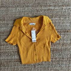 Never Worn! The Material Is Really Soft And Stretchy In A Beautiful Gold/Mustard Color. Cheap Yellow Tops From Urban Outfitters, Collared Crop Top, Mustard Color, Gold Orange, Urban Outfitters Tops, Orange Gold, Mustard, Urban Outfitters, Crop Top