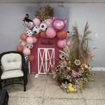 a room with balloons and decorations on the wall