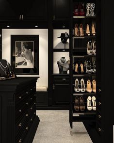 a walk in closet filled with lots of shoes