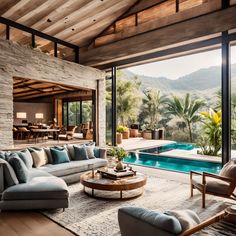 a living room filled with furniture next to a swimming pool