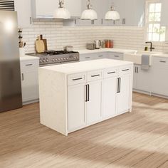 a large kitchen with white cabinets and wood flooring, along with stainless steel appliances