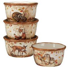 three bowls with animals painted on them and one bowl has an owl in the middle