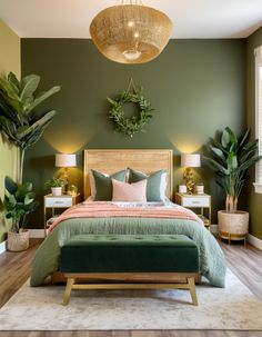 a bedroom with green walls and plants on the wall above the bed, along with two nightstands