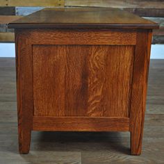 a small wooden table with one drawer open