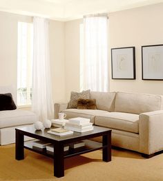 a living room with blue walls and furniture