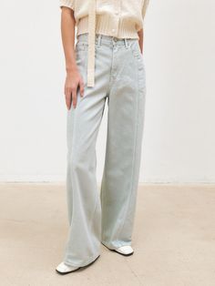 This is MOHAN’s 100% cotton dyed denim pants with a relaxed wide fit from the thighs to the hem. They feature a mid-rise and a vintage wash for a stylish look. The front seam lines and square pocket details add a casual touch. The waistbelt outline and stitch details along the side seams enhance the overall design. - Perfect for daily wear- Can be styled with various tops for different looks- Side pockets add practicality- Features a leather patch detail on the back waist- YKK zipper used for durability Mid-rise Medium Wash Pants With Pockets, Light Wash Mid-rise Bottoms With Pockets, Mid-rise Medium Wash Pants With Multiple Pockets, Soft-washed Medium Wash Denim Bottoms, Square Pocket, Dyed Denim, Ykk Zipper, Pocket Detail, Leather Patches