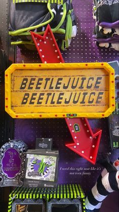 there is a sign that says beetlejuice and has arrows pointing in different directions