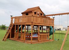 a wooden swing set in the middle of a field