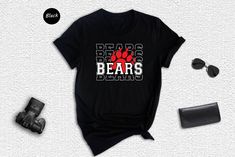 Show your Bears team spirit and pride with this unique Bears Team Shirt! Perfect for any Bears fan, this shirt is sure to be a great addition to any wardrobe. Featuring a classic Bears mascot graphic design, this shirt is sure to represent your team spirit no matter where you go. With its easy-to-care-for construction, this shirt will look great wash after wash. Show your support with this one-of-a-kind shirt! Perfect for Bears fans of all ages and genders, what better way to show your team pride than with this Bears Team Shirt. Get yours today and join the rest of the Bears faithful in supporting their team! HOW TO ORDER: 1️⃣Select the shirt size & color. 2️⃣Choose your text color. 3️⃣Add your text/personalization request 4️⃣Select the quantity. 5️⃣Click to Add to Cart. 6️⃣Start to wait f Black T-shirt With Heat Transfer Vinyl For Sports Season, Game Day School Spirit T-shirt With Heat Transfer Vinyl, Casual T-shirt With Heat Transfer Vinyl For Sports Events, School Spirit T-shirt For Fan Gear, Black T-shirt For Sports Season With Heat Transfer Vinyl, Black T-shirt With Heat Transfer Vinyl For Sports, Black School Spirit T-shirt For College, Black T-shirt For College With School Spirit, Black College T-shirt With School Spirit