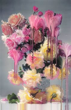 pink and white flowers in a vase with water dripping from the top, on a gray background