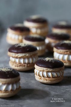 chocolate covered macaroons sitting on top of a table