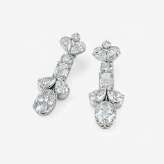 two pairs of diamond earrings, one in white gold and the other in white gold