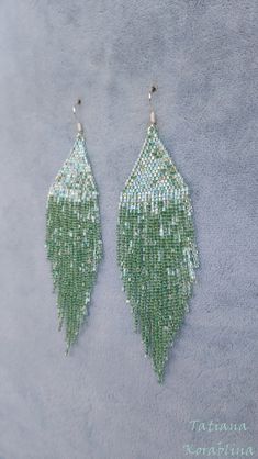 These handmade author's bright sparkling iridescent earrings are made of high-quality Japanese microscopic beads Delica. These earrings look very elegant and weightless. Color:mint . 100% hand made with love! Measurements: Length with hook - about 11.5 cm( 4,52 inch ),Width -3 cm (1,18 inch) Materials: Silver plated ear hooks Japanese microscopic beads Delica Tytan Threadbeige Handmade Green Chandelier Earrings For Party, Green Teardrop Beaded Earrings For Party, Elegant Green Beaded Crystal Earrings, Handmade Green Earrings For Party, Green Chandelier Earrings For Party, Handmade Green Beaded Earrings For Party, Green Beaded Earrings With Dangling Beads For Wedding, Green Beaded Chandelier Earrings For Wedding, Elegant Handmade Green Beaded Earrings