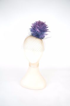 Feathered Flower Fascinator Hat Statement Headpiece A statement cocktail hat, that will certainly make everyone look twice! Purple ombre feathered flower in a deep purple lace base complemented by black veil cascading over the face. The base is 9.5cm diameter and the piece is approximately 10.5cm high.  Secures to the head with an elastic. You are buying the piece you see in the photos. I have tried my utmost to show the colours accurately, however dependent on your monitor settings the colours Fitted Tulle Headpieces For Parties, Summer Party Feather Headpieces, Summer Party Headpiece With Feathers, Summer Party Tulle Headpiece, Summer Party Headpieces With Feathers, Summer Party Headpieces Made Of Tulle, Party Tulle Mini Hats, Fitted Tulle Mini Hats For Party, Summer Party Mini Tulle Hats